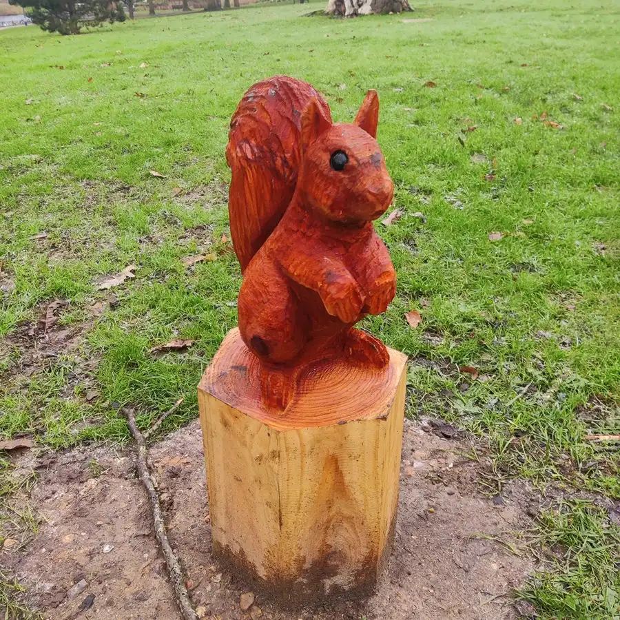 A little squirrel (wooden sculpture) in the park